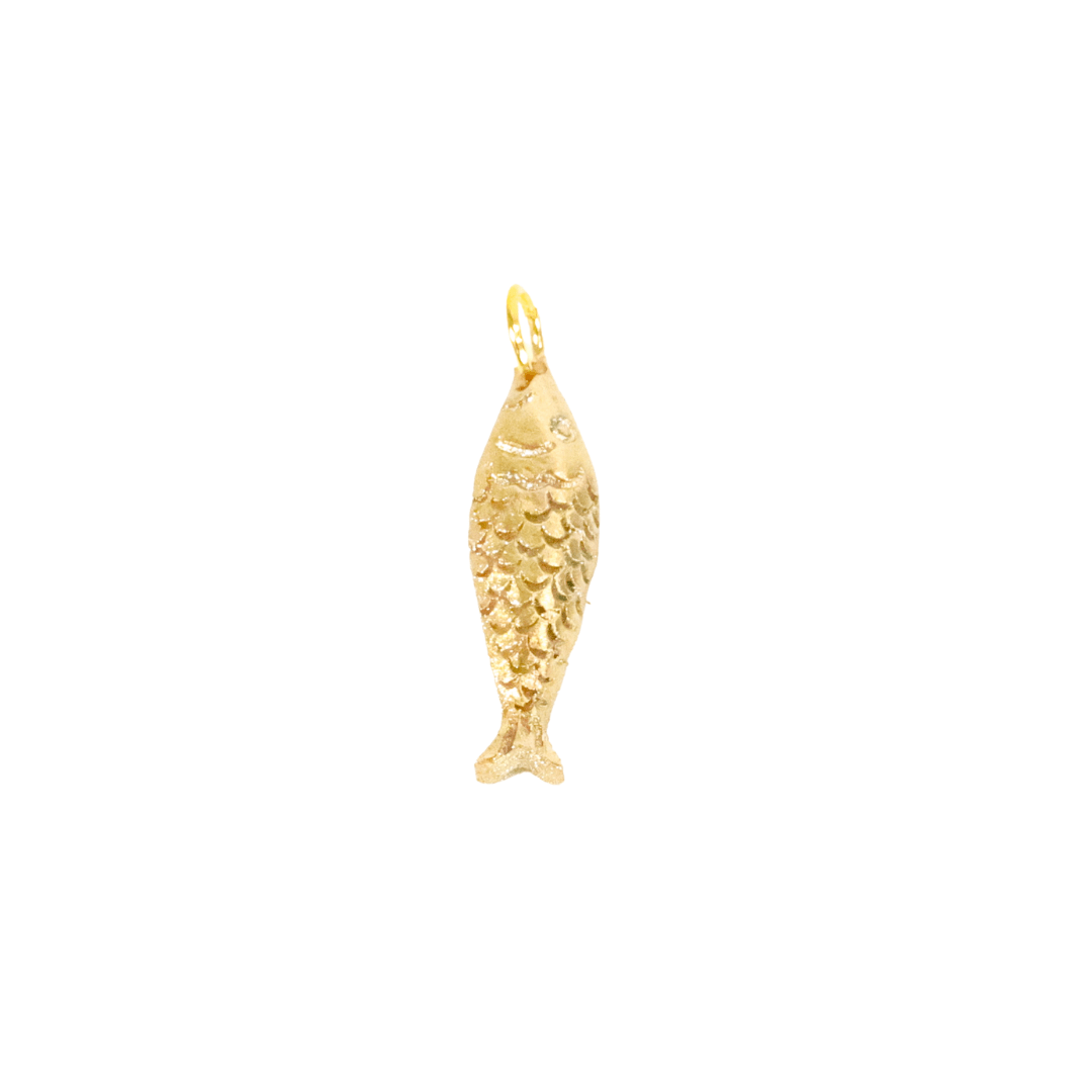 Gold fish-shaped pendant on a white background