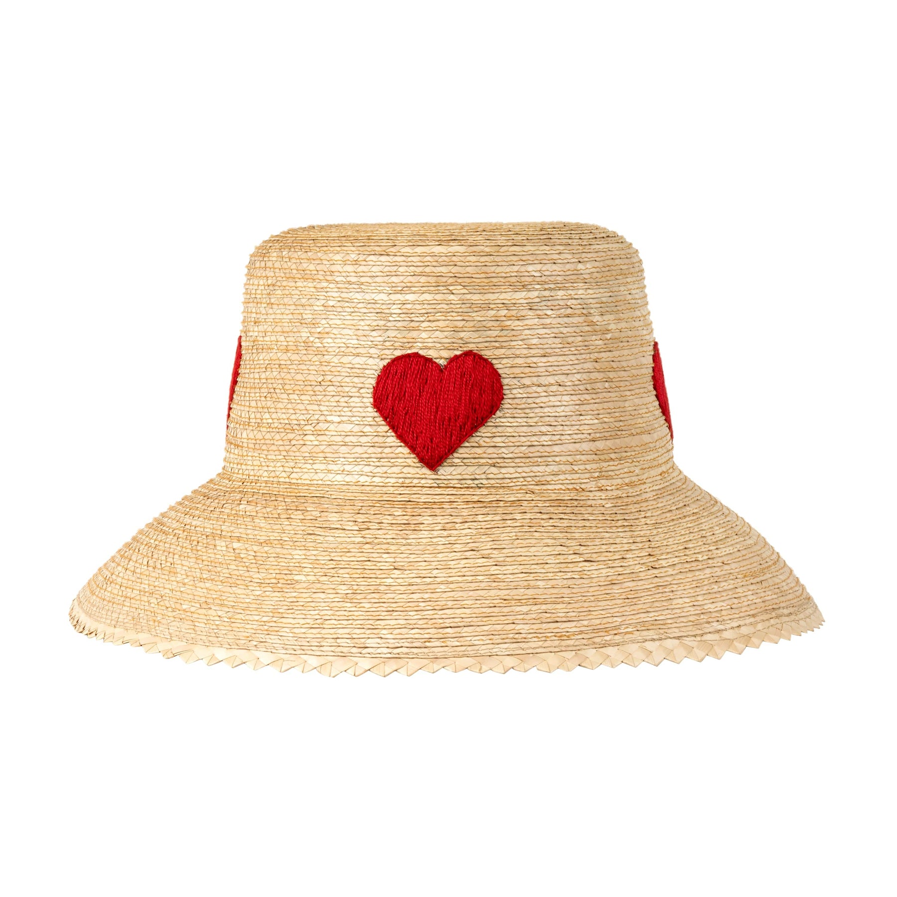 A beige bucket hat with hand-stitched red hearts around the crown and a zig-zag brim.
