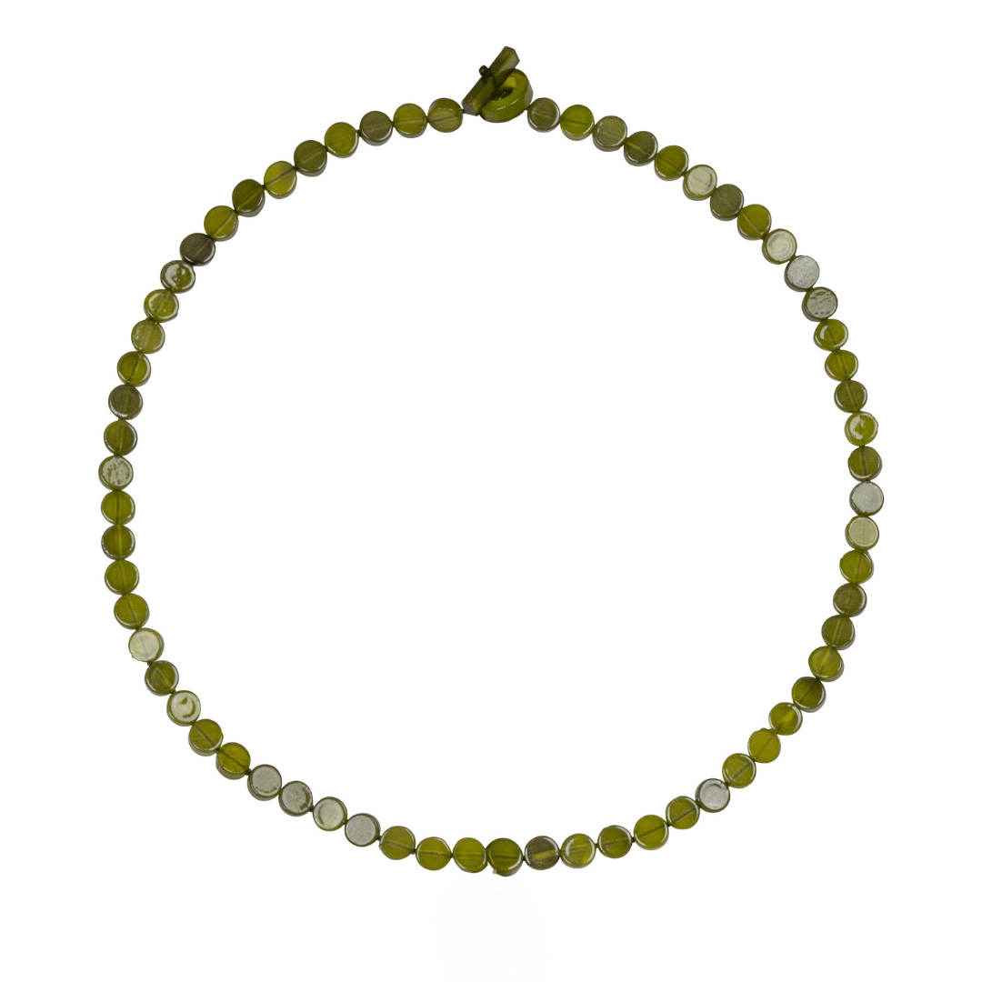 Necklace with green and white beaded chain on a white background