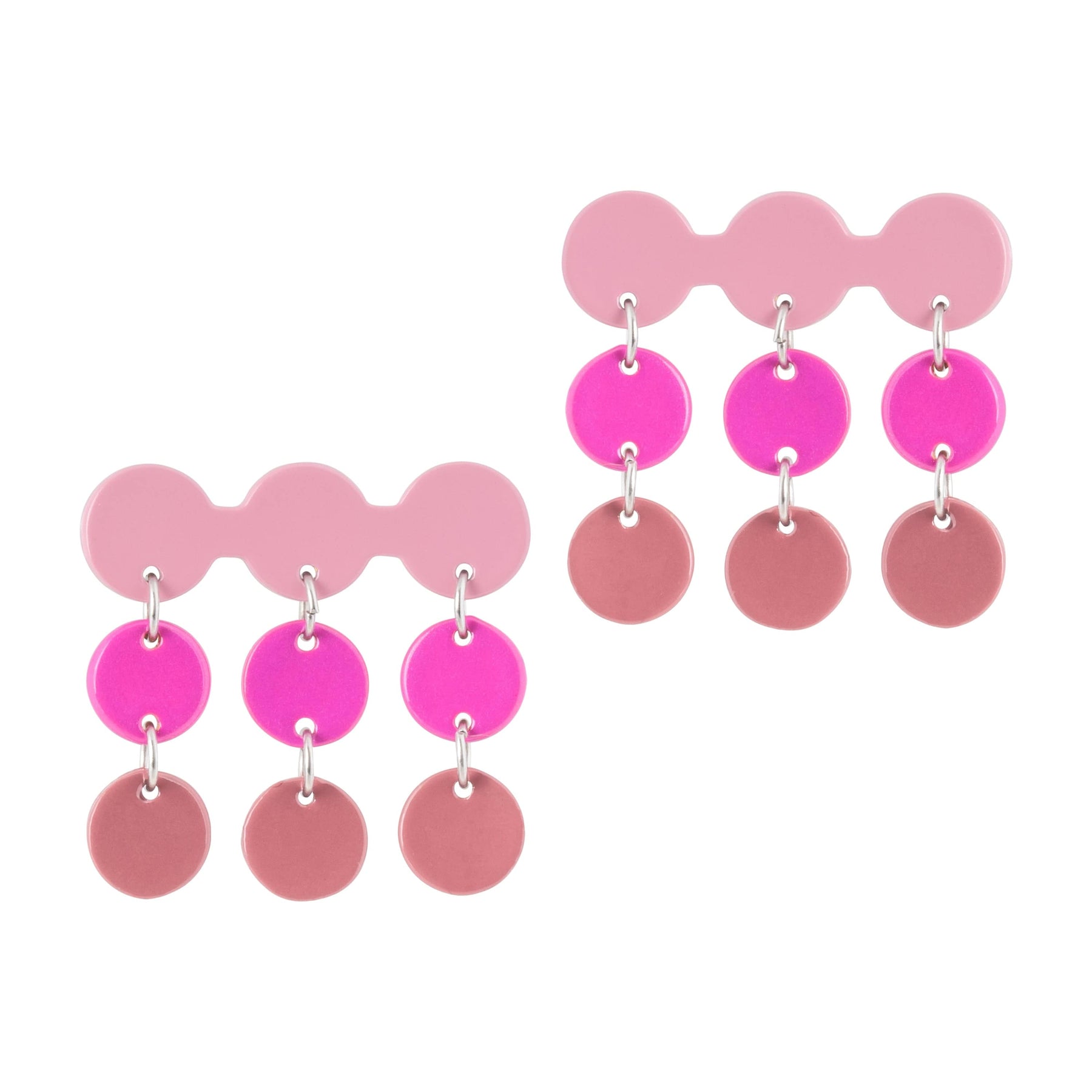 A pair of earrings with a layered design featuring pink and blush tones, made from buffalo horn with stainless steel ear posts.