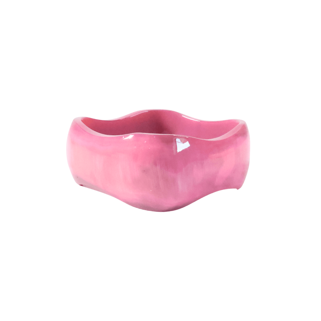 Pink ceramic bowl on a white background