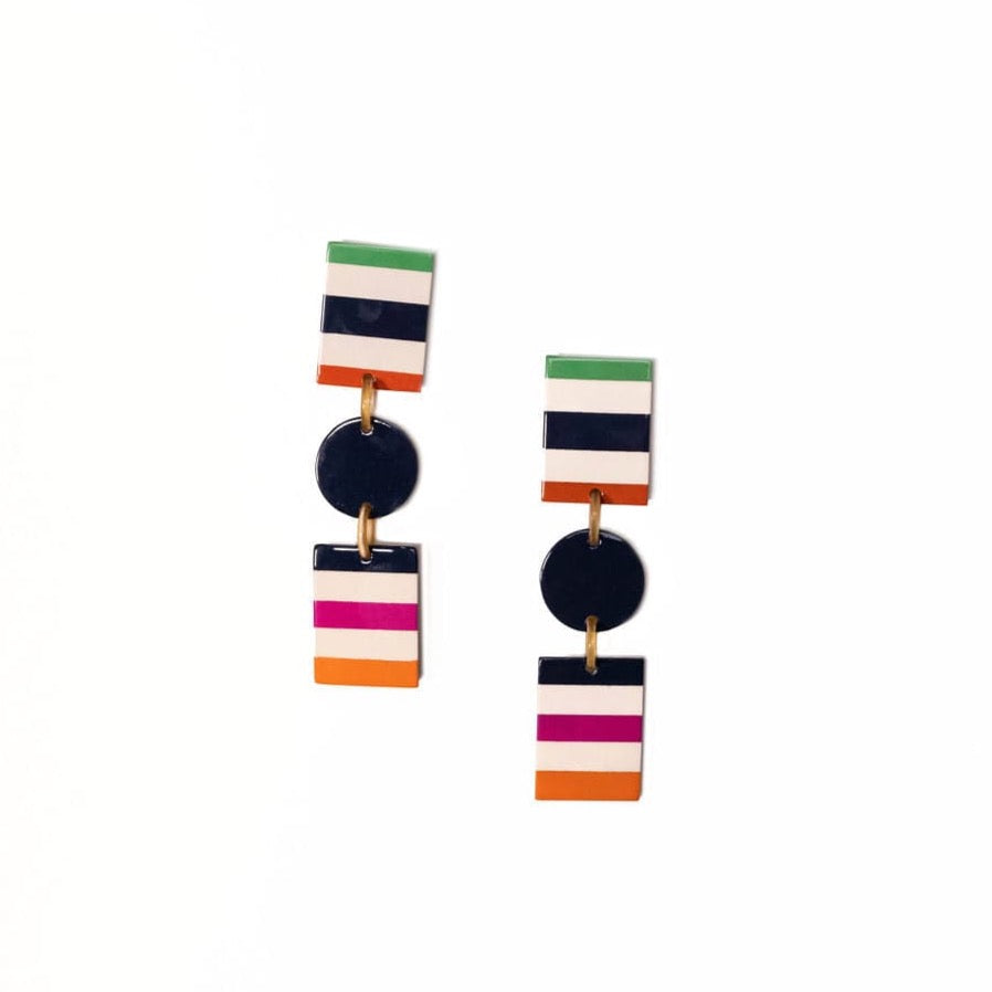 A pair of drop earrings featuring geometric shapes in navy, white, green, pink, and orange colors.