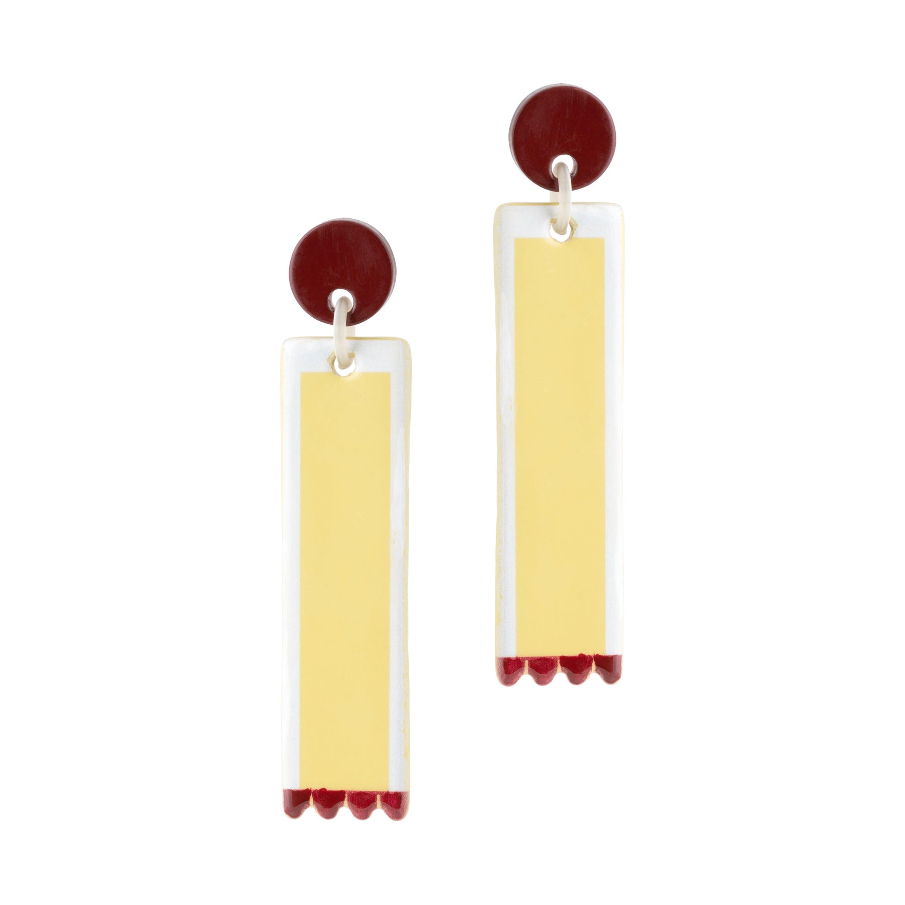 A pair of scalloped dangle earrings with gold, ivory, and burgundy colors.