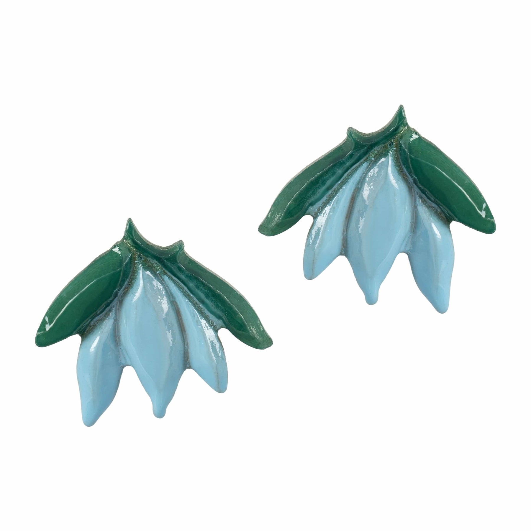 Pair of green and light blue floral-shaped earrings on a white background