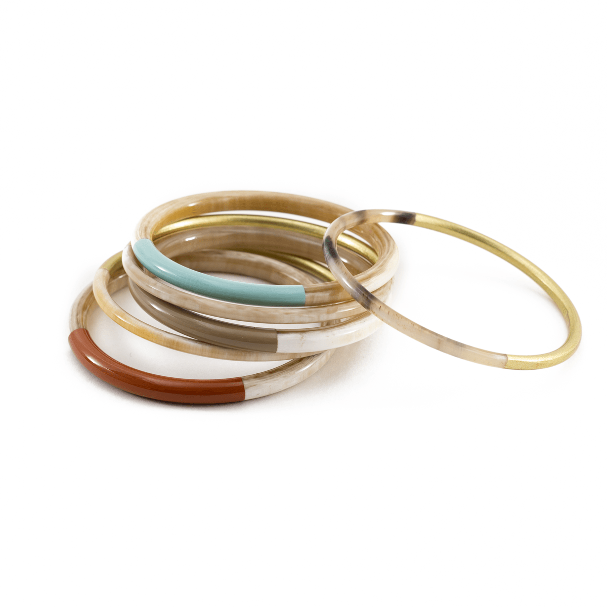 A set of bangles in various colors including gold and beige, with a few that have metallic gold stripes, displayed on a white background.