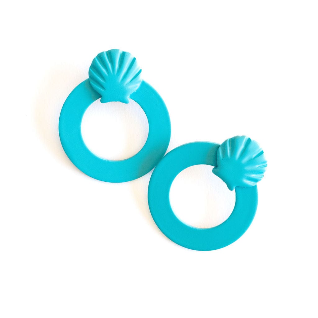 A pair of turquoise shell double circle earrings on a white background